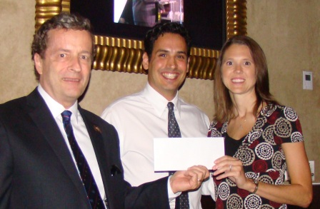 RNASA Treasurer Geoff Atwater and Chairman Rodolfo Gonz&aacute;lez present a check to TAS Program Manager Jessica Cejka