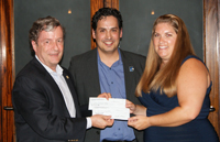 Geoff Atwater and Rodolfo Gonz&aacute;lez presenting a check to Stacey Welch